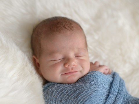Swaddled baby sleeping safely and soundly